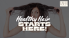 Woman holding up her frizzy, damaged hair