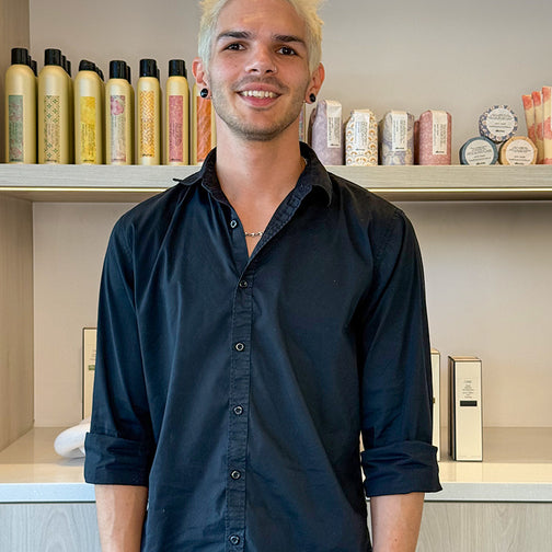 Portrait of Chris, salon assistant and apprentice at LAHH Salon in Miami